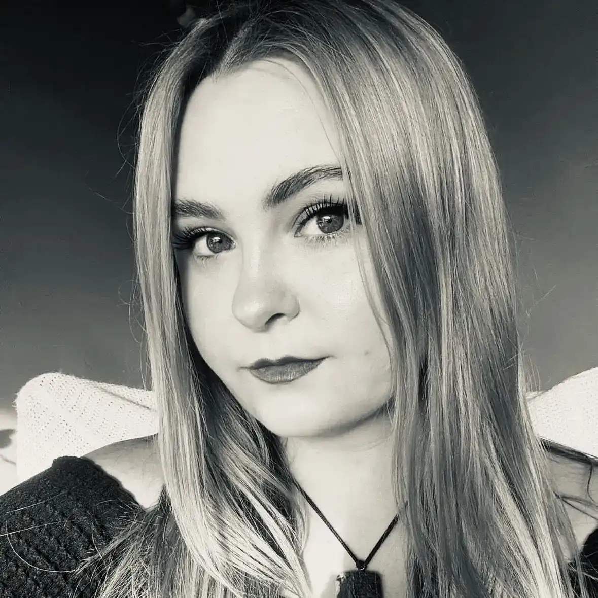 Portrait of Chynna Cline, a professional stylist at Salon Savoir, showcasing their expertise and style.