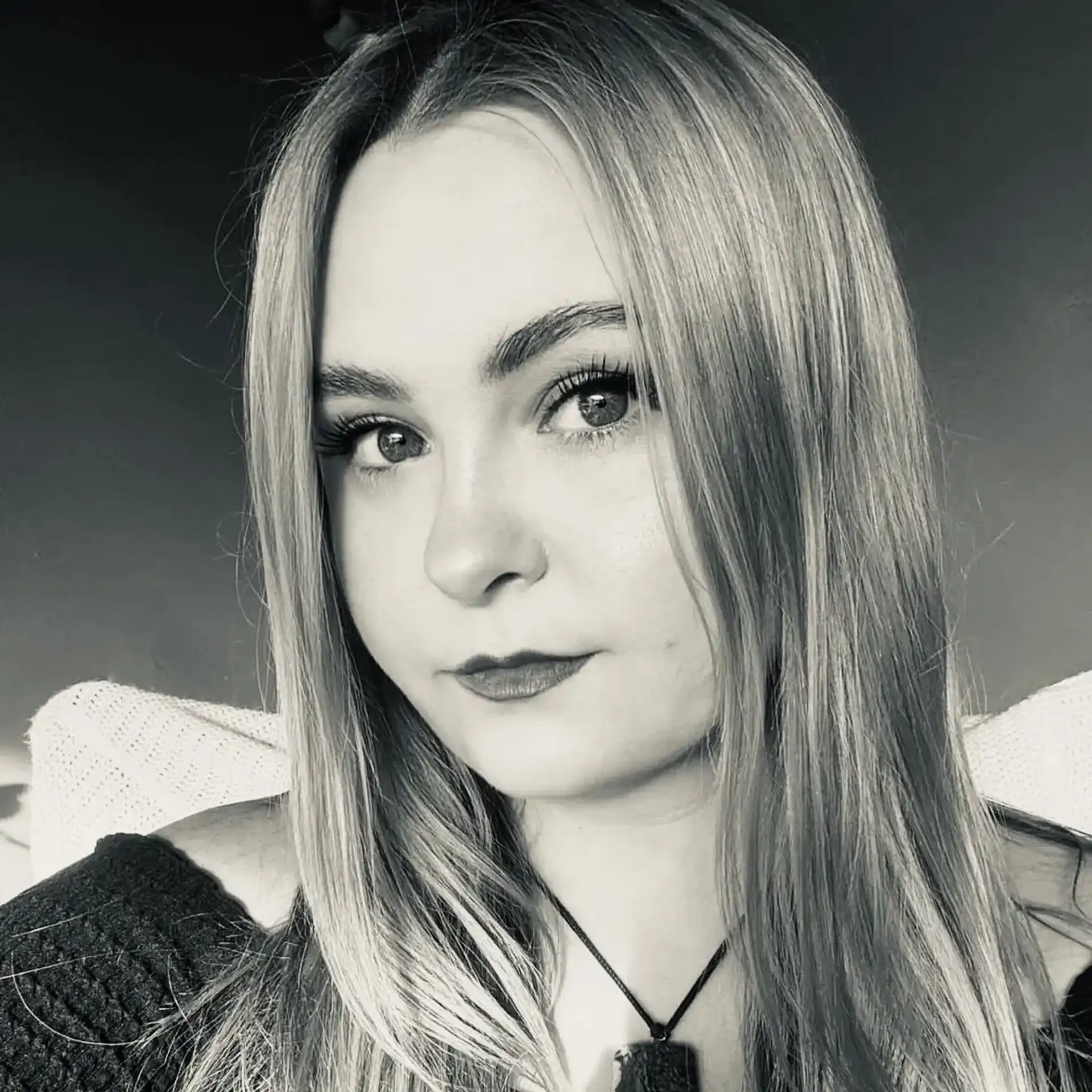 Portrait of Chynna Cline, a professional stylist at Salon Savoir, showcasing their expertise and style.