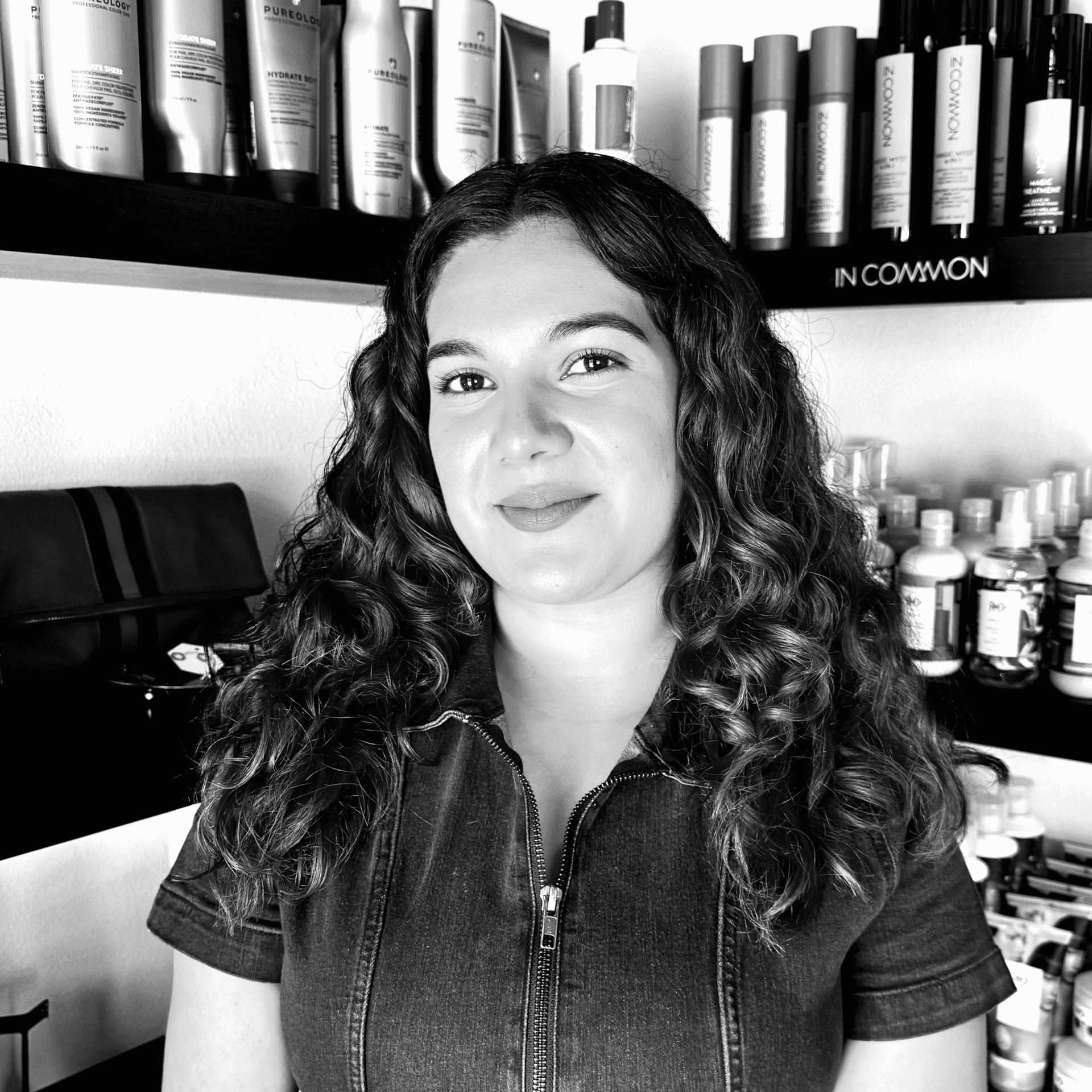 Portrait of Destiny Estrada, a professional stylist at Salon Savoir, showcasing their expertise and style.