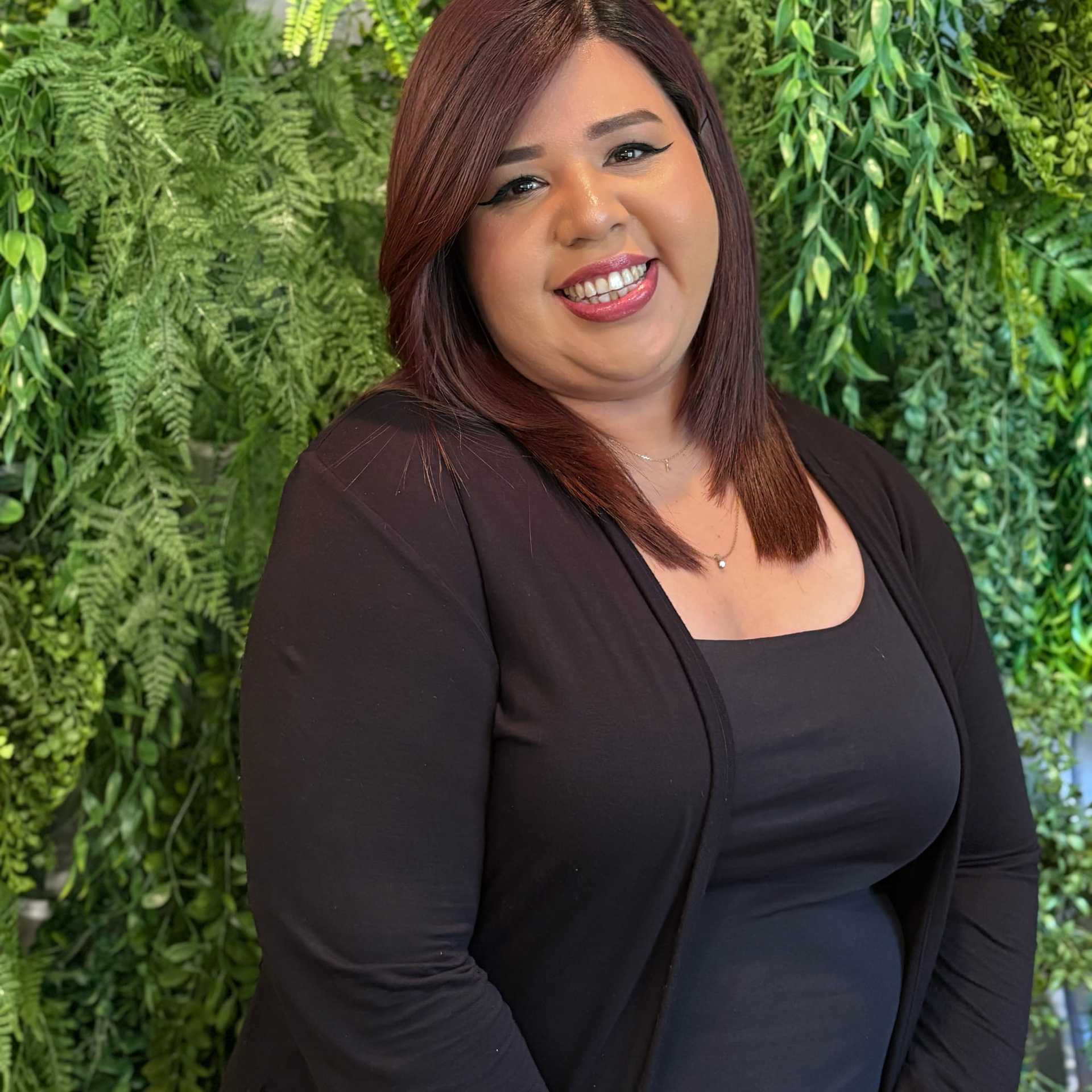 Portrait of Ana Romero, a professional stylist at Salon Savoir, showcasing their expertise and style.