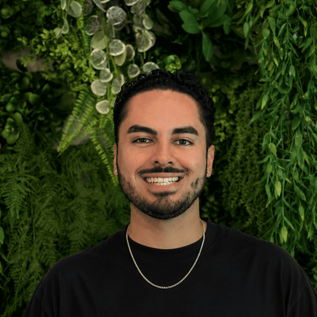 Portrait of Issac Lemus, a professional stylist at Salon Savoir, showcasing their expertise and style.