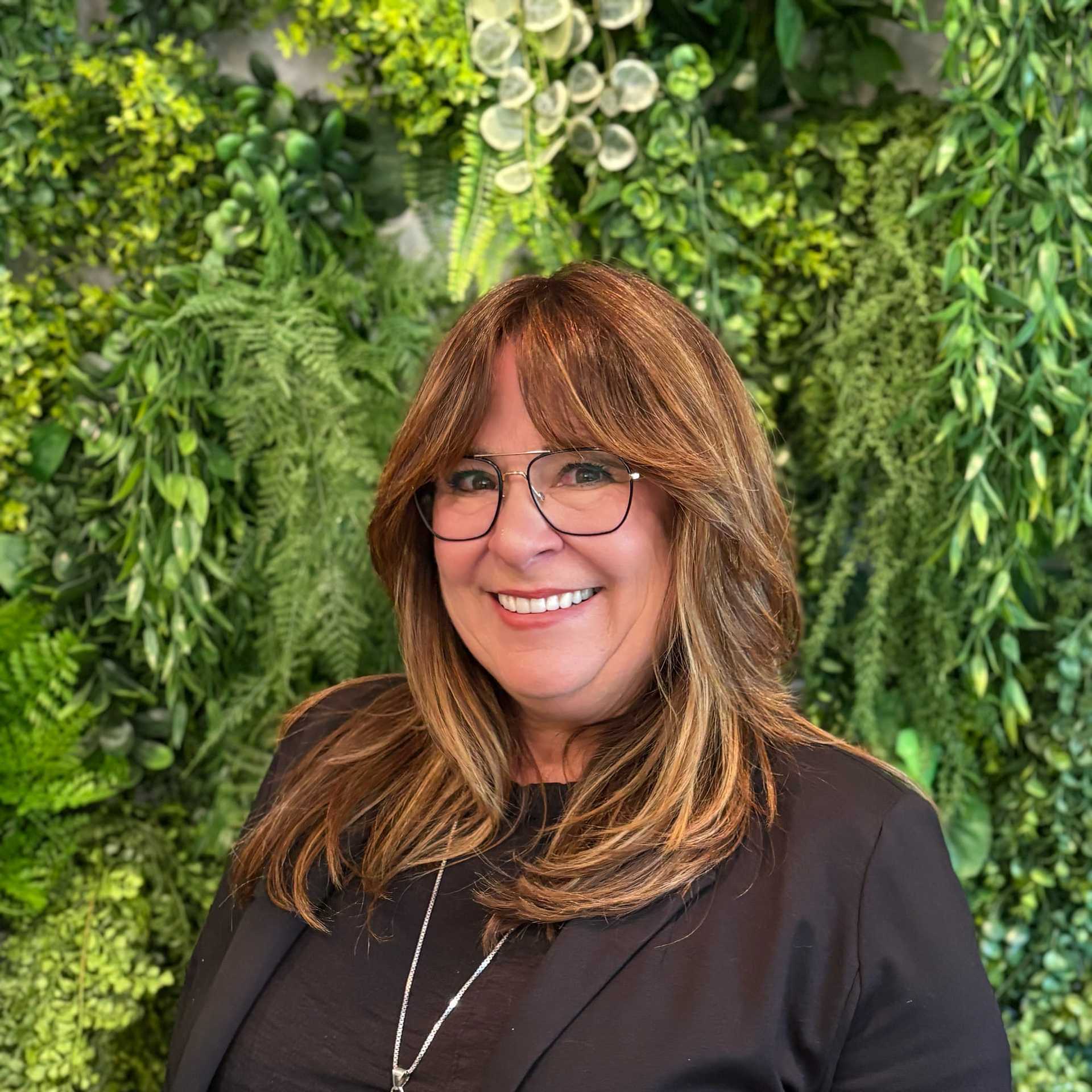 Portrait of Nancy Lee, a professional stylist at Salon Savoir, showcasing their expertise and style.
