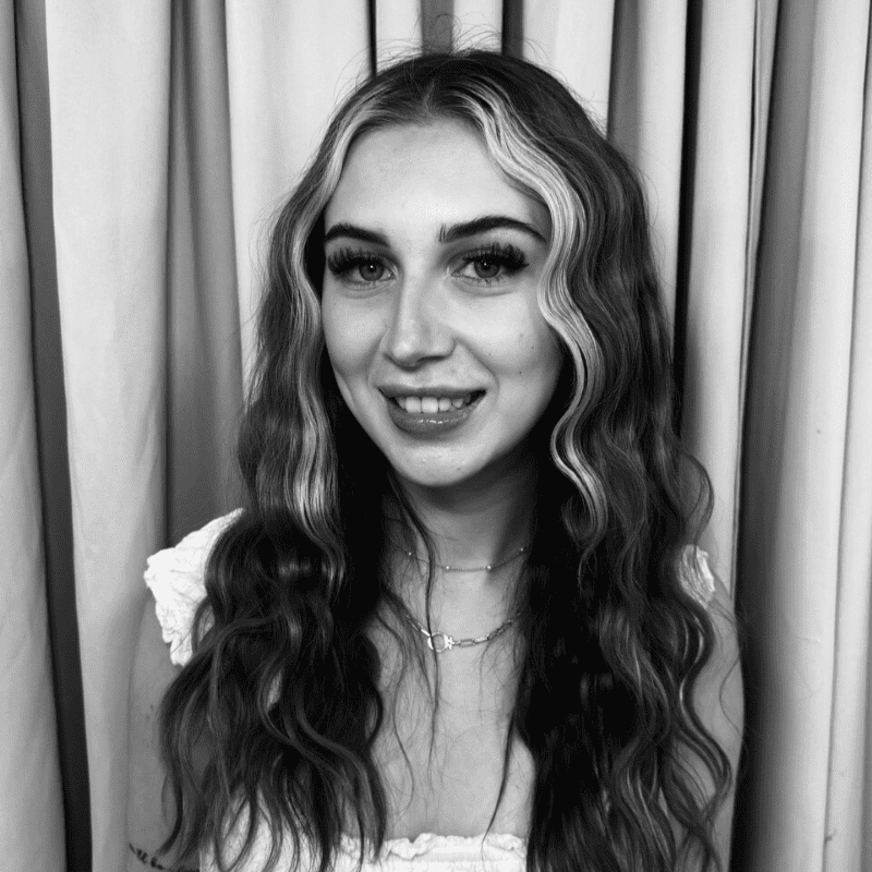 Portrait of Victoria, a professional stylist at Salon Savoir, showcasing their expertise and style.