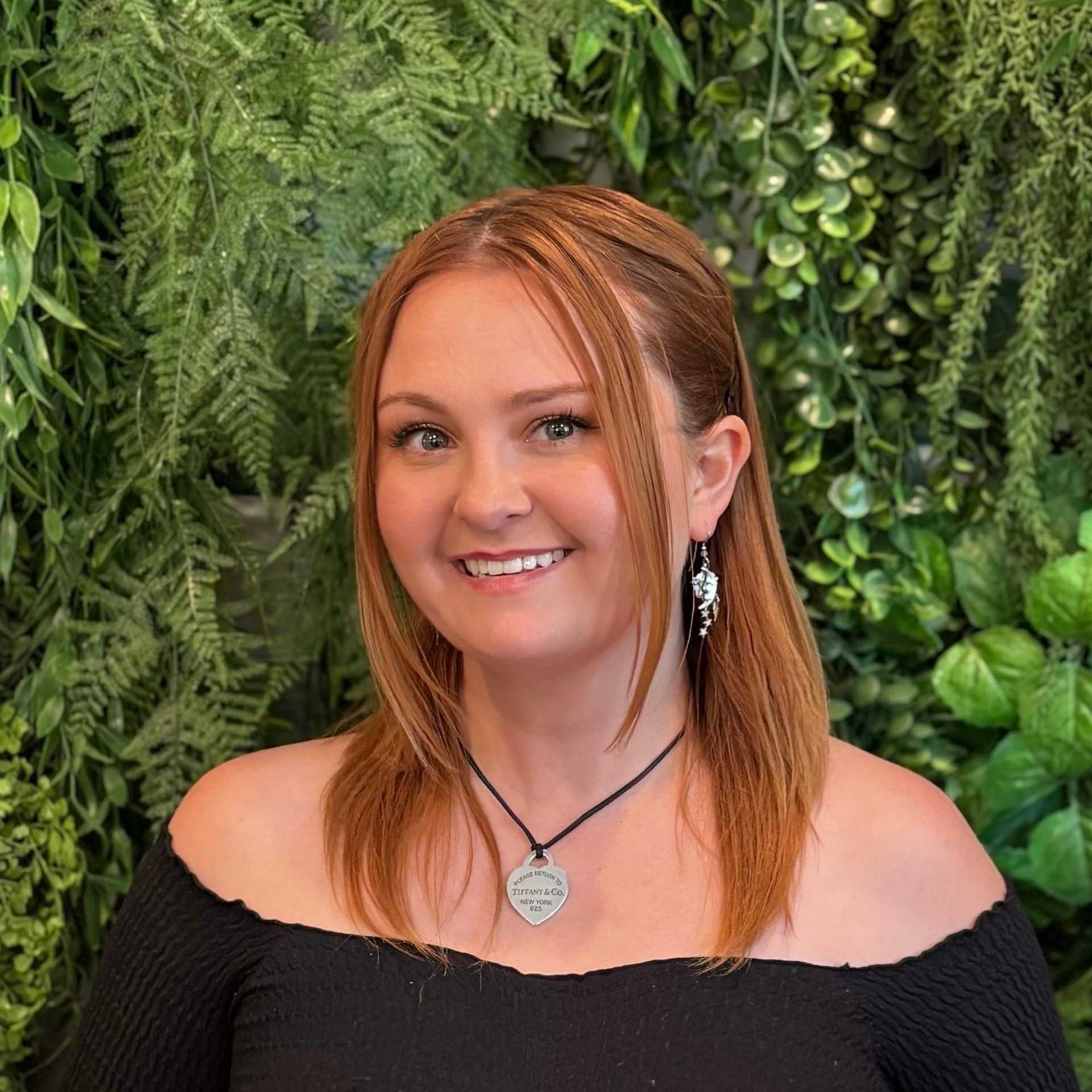 Portrait of Chynna Cline, a professional stylist at Salon Savoir, showcasing their expertise and style.