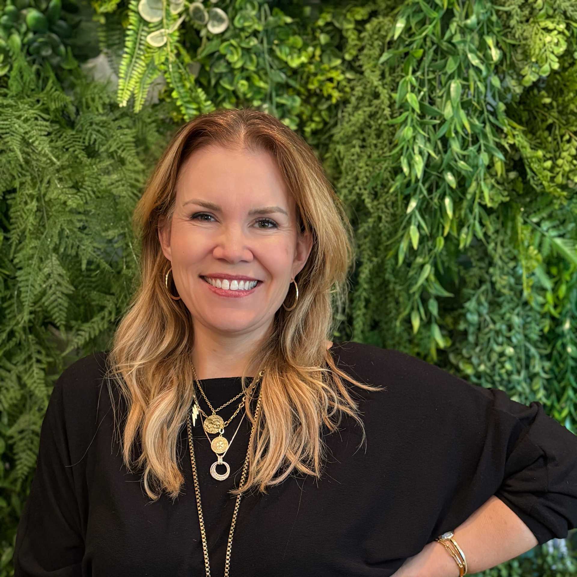 Portrait of Michelle Ward, a professional stylist at Salon Savoir, showcasing their expertise and style.