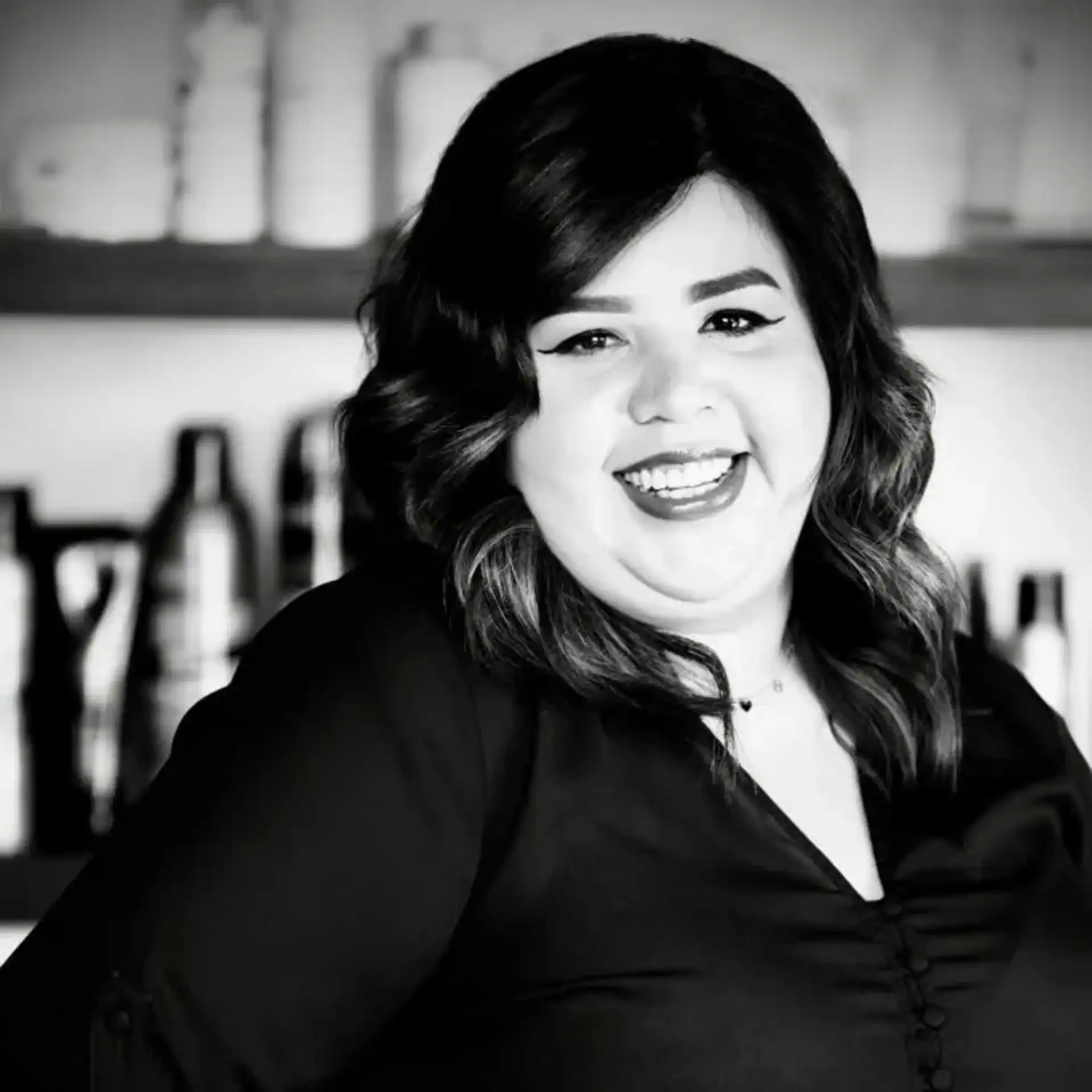 Portrait of Ana Romero, a professional stylist at Salon Savoir, showcasing their expertise and style.