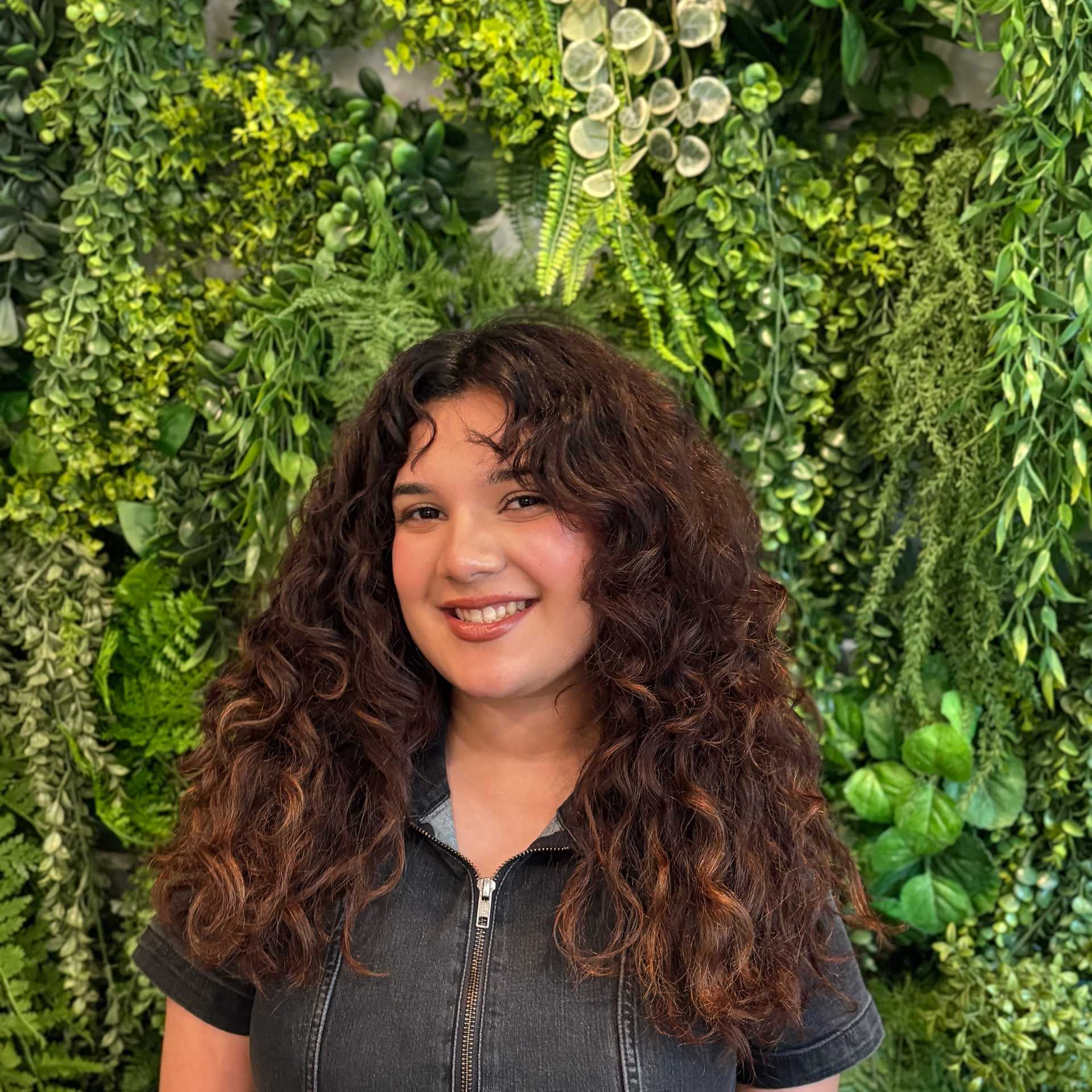 Portrait of Destiny Estrada, a professional stylist at Salon Savoir, showcasing their expertise and style.