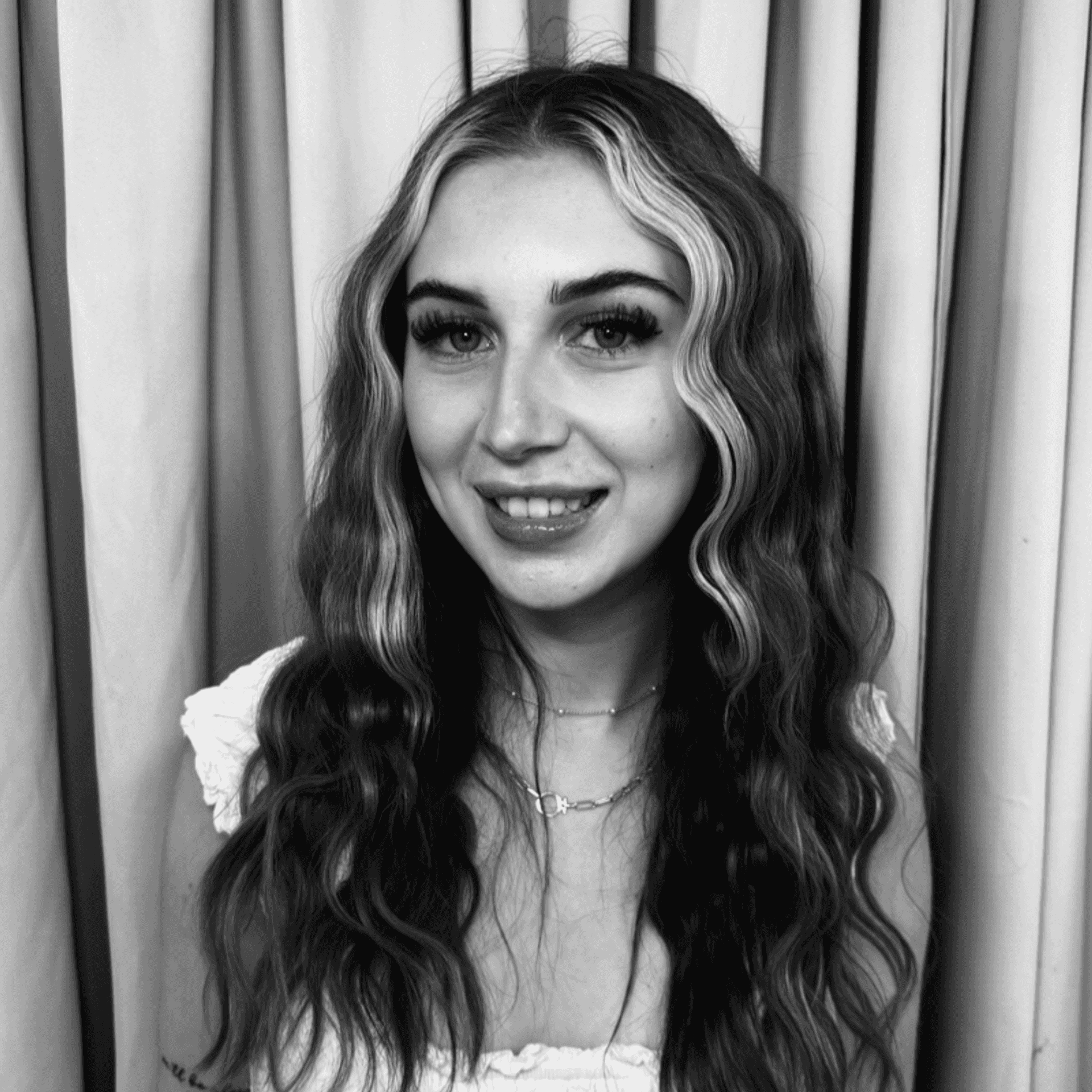 Portrait of Victoria, a professional stylist at Salon Savoir, showcasing their expertise and style.