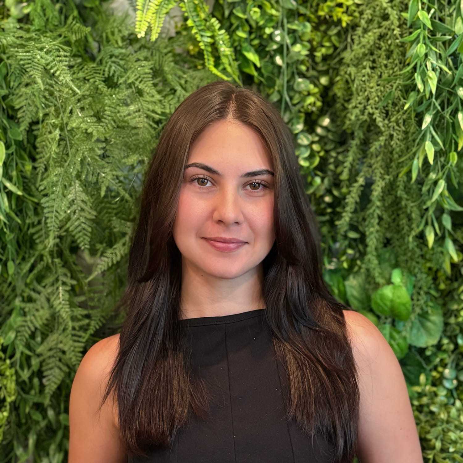 Portrait of Violet Demetris, a professional stylist at Salon Savoir, showcasing their expertise and style.