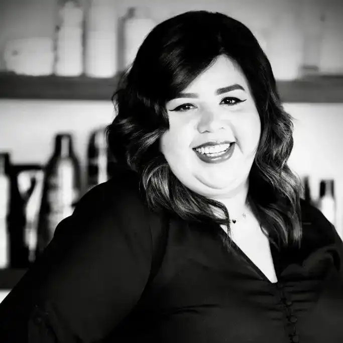 Portrait of Ana Romero, a professional stylist at Salon Savoir, showcasing their expertise and style.