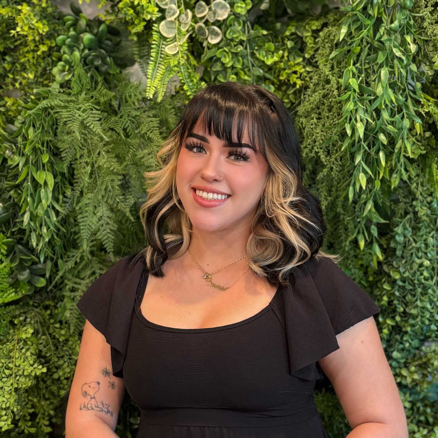 Portrait of Natalia Gonzalez, a professional stylist at Salon Savoir, showcasing their expertise and style.