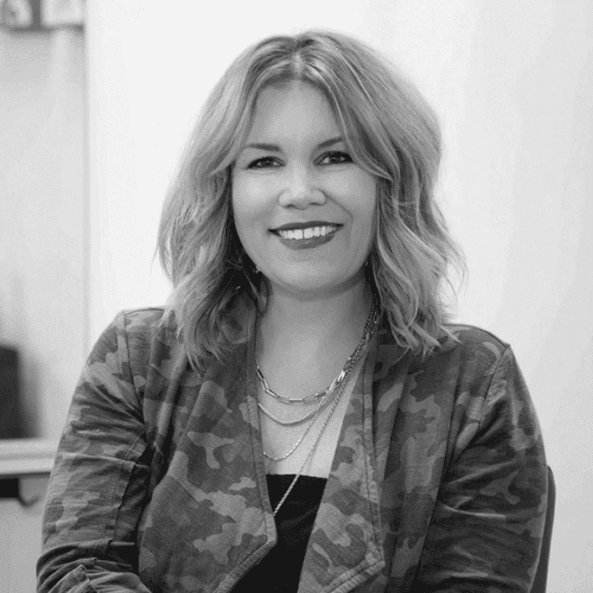 Portrait of Michelle Ward, a professional stylist at Salon Savoir, showcasing their expertise and style.